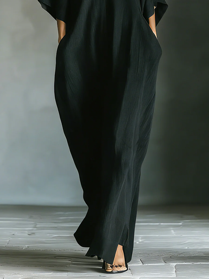 Alessandra | Vestido largo negro oversize minimalista con mangas de kimono