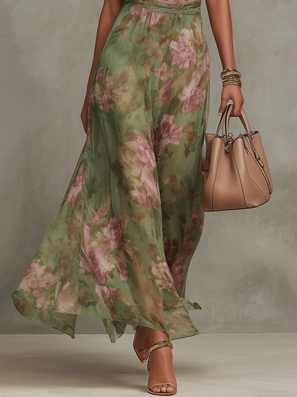 Serena - Vestido largo de gasa verde con estampado floral y escote halter.